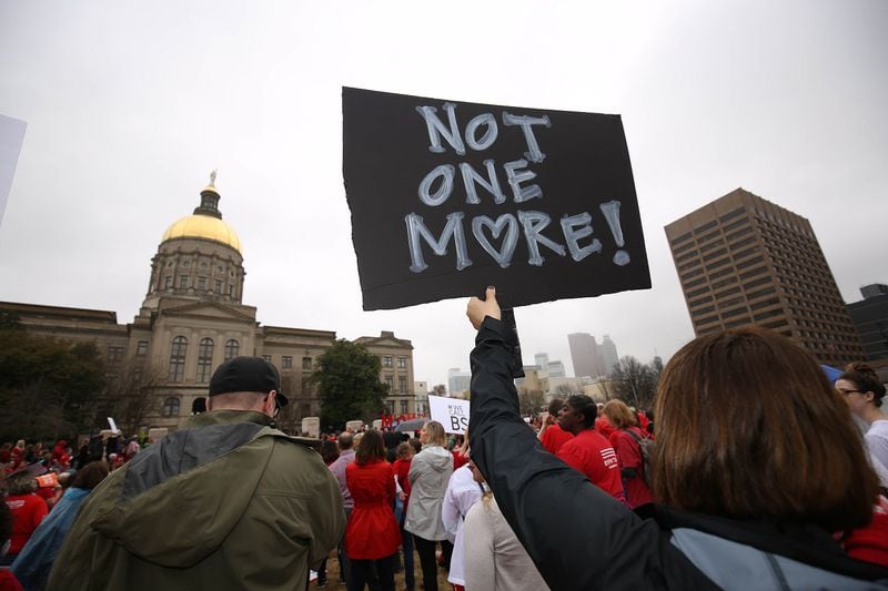 At a news conference set for this morning, House Democrats plan to urge Gov. Brian Kemp to call a special legislative session to adopt firearms limits designed to garner bipartisan support. Pictured is a gun control rally staged at Liberty Plaza in Atlanta in 2018. (Jason Getz/The Atlanta Journal-Constitution)
