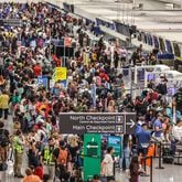 Passengers crowd the Terminal North check-in area at Hartsfield-Jackson International Airport on Friday as a global IT outage impacts airlines and airports. (John Spink / AJC)