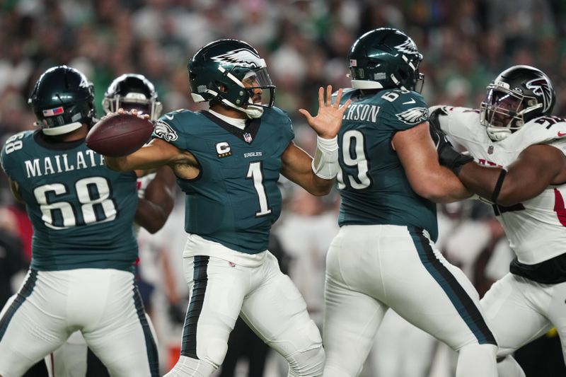 Philadelphia Eagles quarterback Jalen Hurts (1) looks to pass during the first half of an NFL football game against the Atlanta Falcons on Monday, Sept. 16, 2024, in Philadelphia. (AP Photo/Matt Slocum)