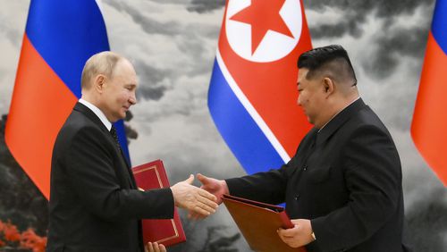 Russian President Vladimir Putin, left, and North Korea's leader Kim Jong Un exchange documents during a signing ceremony of the new partnership in Pyongyang, North Korea, on Wednesday, June 19, 2024. Putin and Kim signed a new partnership that includes a vow of mutual aid if either country is attacked, during a Wednesday summit that came as both face escalating standoffs with the West. (Kristina Kormilitsyna, Sputnik, Kremlin Pool Photo via AP)