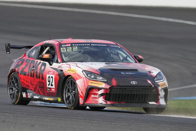 Keanu Reeves drives during the GR Cup Series auto race at Indianapolis Motor Speedway, Saturday, Oct. 5, 2024, in Indianapolis. (AP Photo/Darron Cummings)