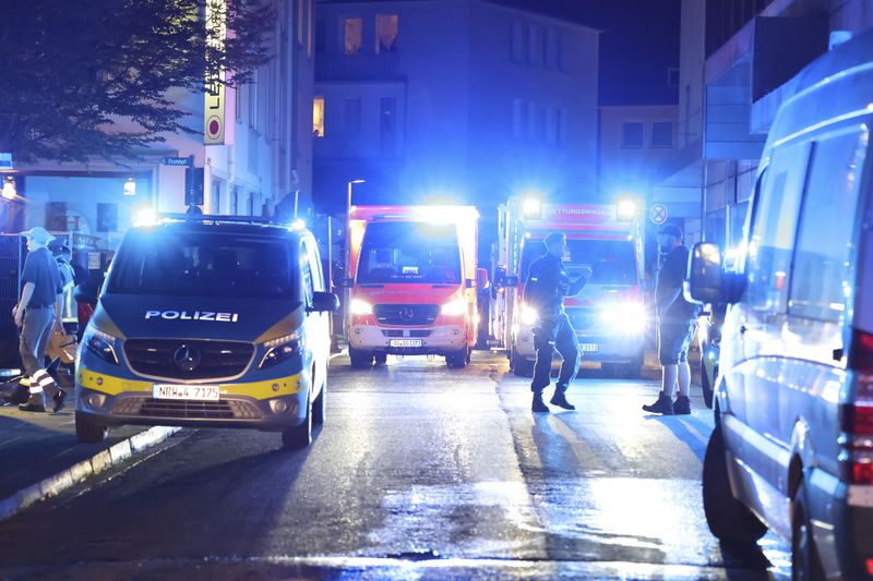 Police and ambulances near the scene where people were killed and injured in an attack at a festival in Solingen, western Germany, the German dpa news agency reported, Friday, Aug. 23, 2024. (Gianni Gattus/dpa via AP)