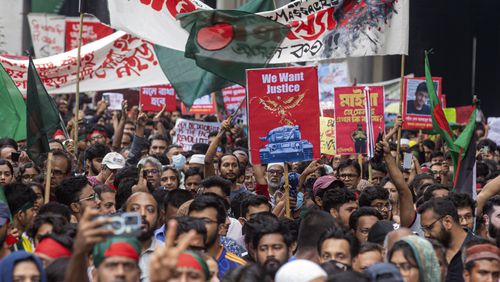 Activists take part in a protest march against Prime Minister Sheikh Hasina and her government to demand justice for more than 200 people killed in last month's violent demonstrations, in Dhaka, Bangladesh, Friday, Aug. 2, 2024. (AP Photo/Rajib Dhar)