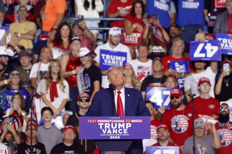 Republican presidential nominee former President Donald Trump looks up at a campaign video at a campaign rally at the Mohegan Sun Arena at Casey Plaza in Wilkes-Barre, Pa., Saturday, Aug. 17, 2024. (AP Photo/Laurence Kesterson)