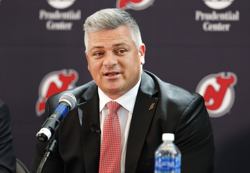 FILE - New Jersey Devils NHL hockey team new head coach Sheldon Keefe answers questions from reporters during press conference Tuesday, May 28, 2024, in Newark, N.J. (AP Photo/Noah K. Murray, File)