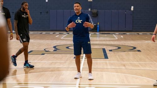 Georgia Tech men's basketball coach Damon Stoudamire works with his team during a practice.