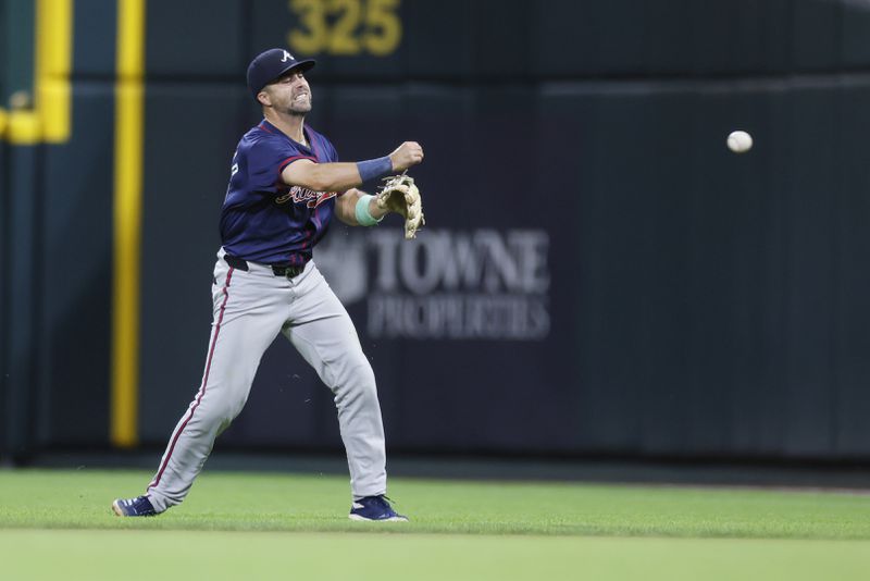 Atlanta Braves second baseman Whit Merrifield throws out Cincinnati Reds' TJ Friedl during the ninth inning of a baseball game, Wednesday, Sept. 18, 2024, in Cincinnati. (AP Photo/Jay LaPrete)