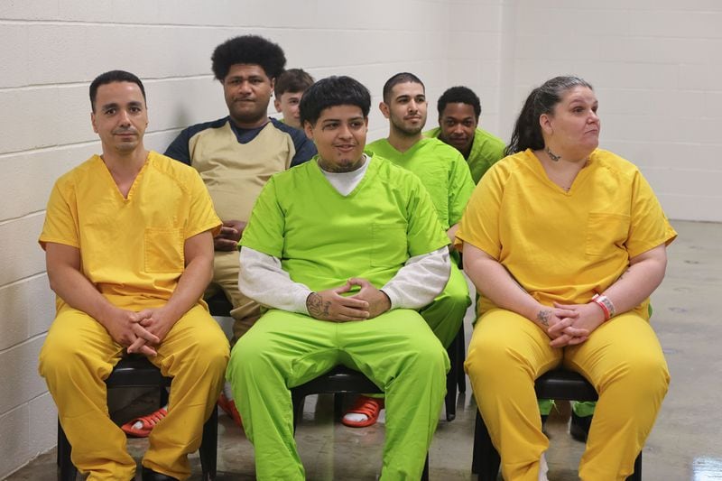 Andrick Barron, second from left, and fellow inmates at Cobb County Detention Facility in Marietta attend a graduation ceremony to receive their GEDs on Tuesday, May 28, 2024. (Natrice Miller/ AJC)