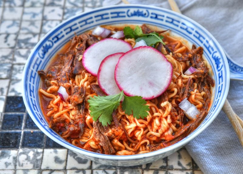 The Birria Ramen shown here is topped with onions, cilantro and radish. Styling by Kate Williams / Chris Hunt for the AJC