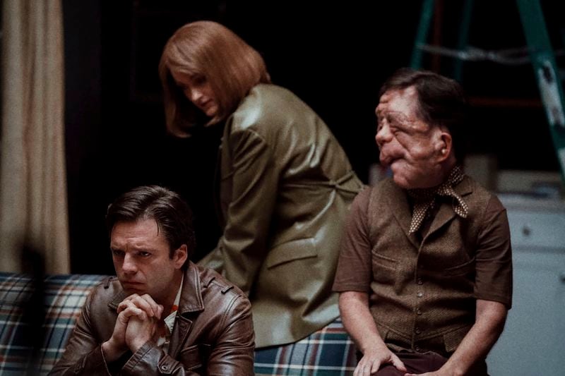 This image released by A24 shows Matt Infante, from left, Renate Reinsve, and Adam Pearson in a scene from "A Different Man." (Matt Infante/A24 via AP)