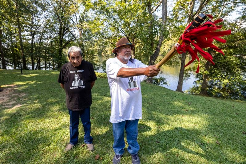 Robyn Soweka Sr., of Hickory Ground Tribal Town, right, describes a tribal challenge issued to the Poarch Band, Tuesday, Sept. 24, 2024, in Wetumoka, Ala. At left is George Thompson, who is the Mekko, a ceremonial leader, of Hickory Ground in the Muscogee Nation. (AP Photo/Vasha Hunt)