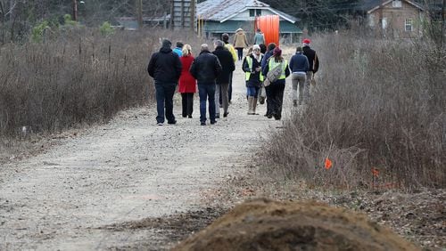 Local residents walk on an undeveloped portion of the Beltline in the Pittsburgh neighborhood in Atlanta. Curtis Compton ccompton@ajc.com