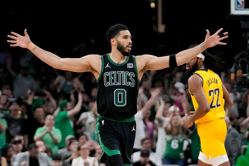 Boston Celtics forward Jayson Tatum reacts during the second half of Game 2 of the NBA Eastern Conference basketball finals against the Indiana Pacers, Thursday, May 23, 2024, in Boston. (AP Photo/Steven Senne)