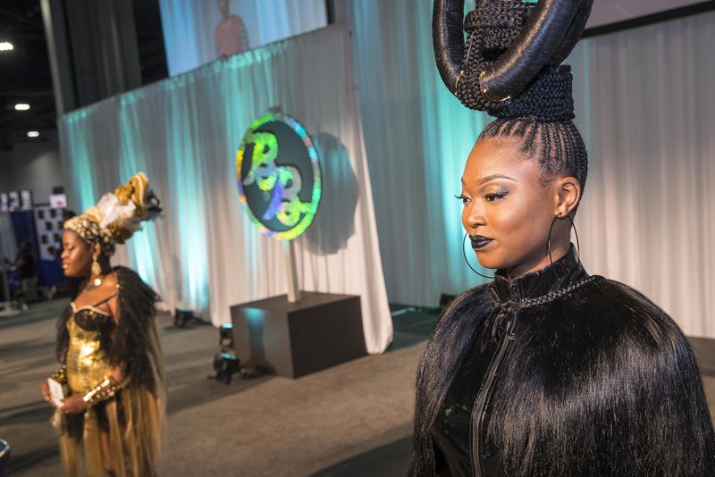 A hair model shows off her queenly coiffure during a competition at the Spring 2018 Bronner Bros. International Beauty Show at the Georgia World Congress Center.  File photo by Alyssa Pointer/alyssa.pointer@ajc.com