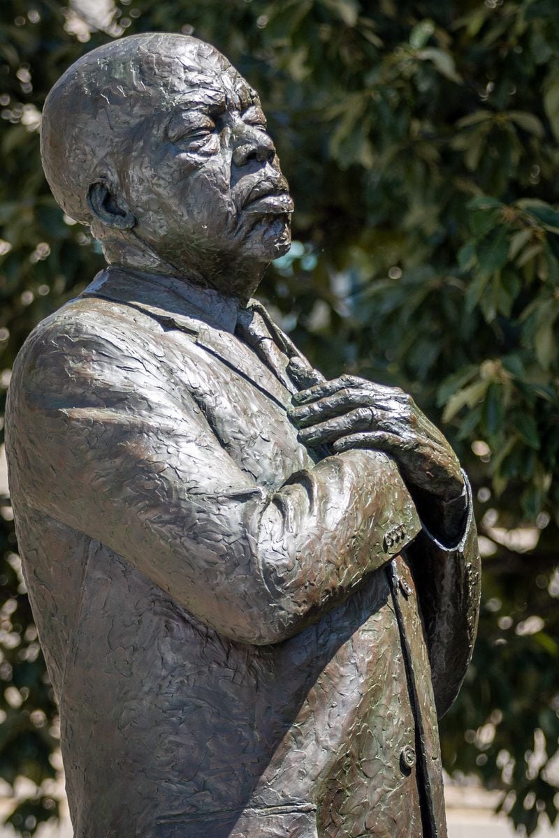 The statue of the late Congressman John Lewis stands in Decatur after the unveiling ceremony on Saturday, Aug 24, 2024.  (Steve Schaefer / AJC)