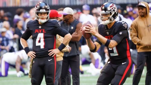 Atlanta Falcons starting quarterback Taylor Heinicke (4) watches quarterback Desmond Ridder (9) during warmups before an NFL football game In Atlanta on Sunday, Nov. 5, 2023 between the Atlanta Falcons and the Minnesota Vikings. (Bob Andres for the Atlanta Journal Constitution)