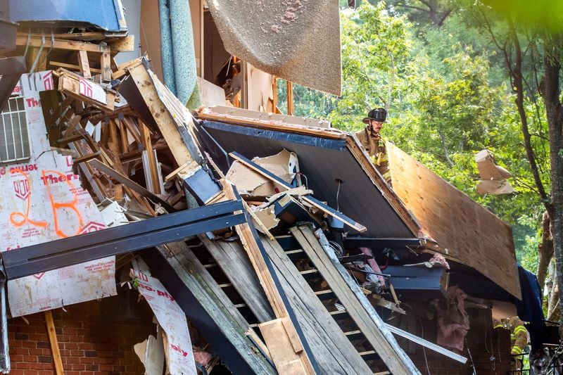 DeKalb County firefighters clear debris from the Arrive Perimeter apartment complex in Dunwoody after an explosion damaged the building Sunday, September 12, 2021. STEVE SCHAEFER FOR THE ATLANTA JOURNAL-CONSTITUTION