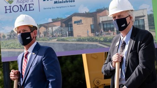200923-Marietta- Gov. Brian Kemp, left, and Former Gov. Roy Barnes pose for photos during a groundbreaking ceremony for MUST Ministries’ new homeless shelter in Marietta on Wednesday, September 23, 2020. Ben Gray for the Atlanta Journal-Constitution
