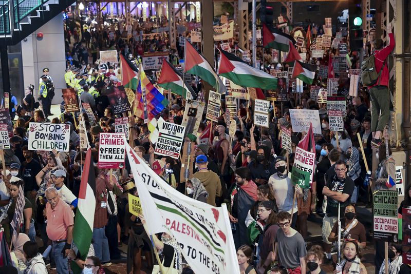 Protesters march during a demonstration outside the Democratic National Convention Thursday, Aug. 22, 2024, in Chicago. (AP Photo/Noah Berger)