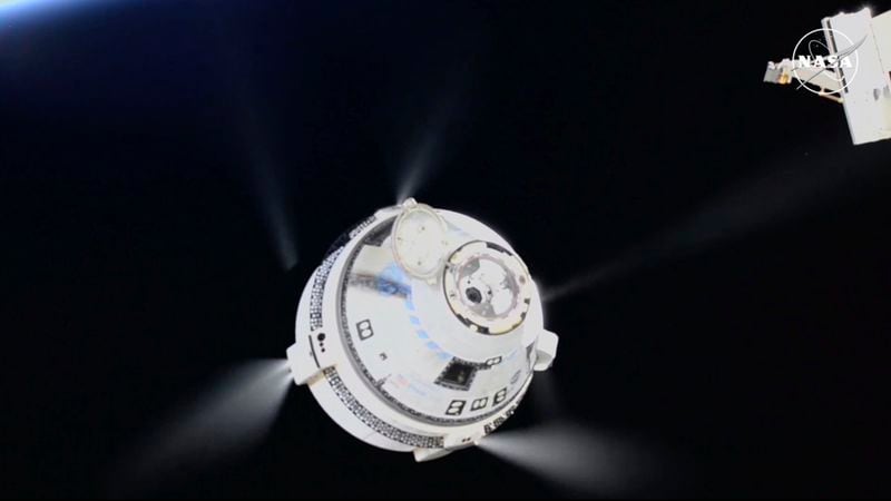 In this image from video provided by NASA, the unmanned Boeing Starliner capsule fires its thrusters as it pulls away from the International Space Station on Friday, Sept. 6, 2024. (NASA via AP)