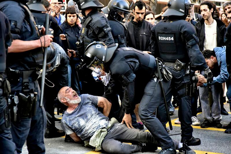 Police and demonstrators clash during a protest outside the Park Guell in Barcelona, Spain, Thursday May 23, 2024, against the closure of the public park for a private event, the Louis Vuitton fashion show for the Cruise 2025 collection. (David Oller/Europa Press via AP)