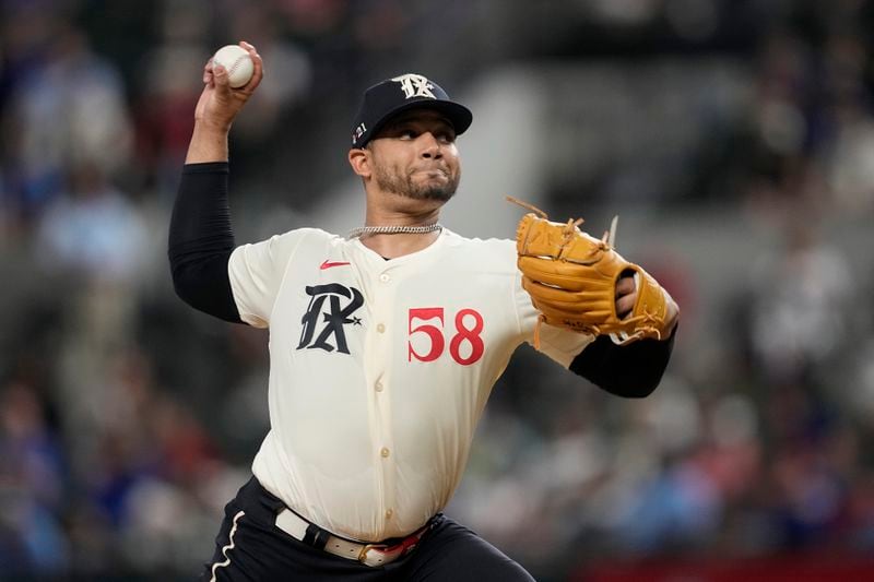 Texas Rangers starting pitcher Gerson Garabito throws in the first inning of a baseball game against the Los Angeles Angels, Friday, Sept. 6, 2024, in Arlington, Texas. (AP Photo/Tony Gutierrez)