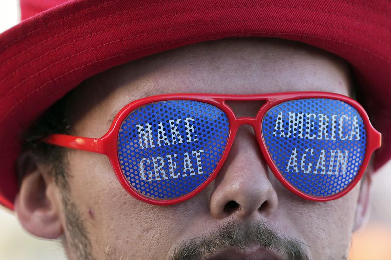 A supporter of Republican presidential nominee former President Donald Trump waits in line to enter a campaign rally at the Butler Farm Show, Saturday, Oct. 5, 2024, in Butler, Pa. (AP Photo/Julia Demaree Nikhinson)