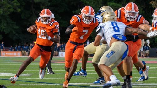 Nick Grimstead, quarterback for North Cobb, finds a hole during the football game against McEachern in Kennesaw, GA on August 23, 2024 (Jamie Spaar for the Atlanta Journal Constitution)