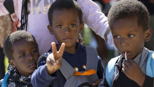 Children attend a back to school health fair in Milwaukee, on Saturday Aug. 10, 2024. (AP Photo/Jeffrey Phelps)