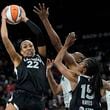 Las Vegas Aces center A'ja Wilson (22) grabs a rebound against the Seattle Storm during the second half in Game 2 of a WNBA basketball first-round playoff game Tuesday, Sept. 24, 2024, in Las Vegas. (AP Photo/John Locher)