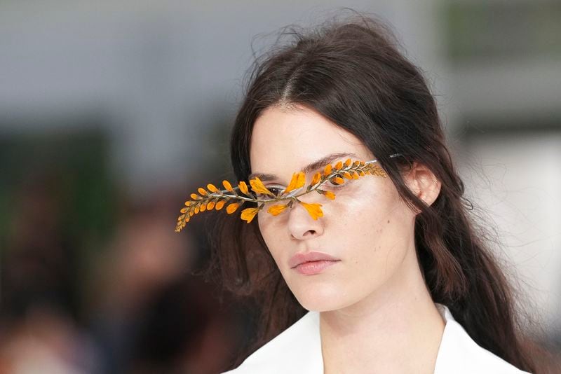 A model wears a creation as part of the Issey Miyake Spring/Summer 2025 collection presented Friday, Sept. 27, 2024 in Paris. (Photo by Scott A Garfitt/Invision/AP)