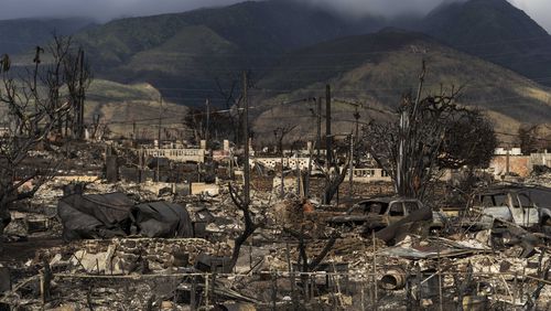 FILE - Damaged property lies scattered in the aftermath of a wildfire in Lahaina, Hawaii, Aug. 21, 2023. (AP Photo/Jae C. Hong, File)