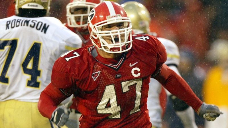 Georgia defensive end David Pollack (47) reacts after Georgia Tech quarterback Reggie Ball is sacked for 13-yard loss in their match up Saturday, Nov. 27, 2004.