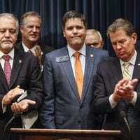 Feb. 4, 2020 - Atlanta - State school Superintendent Richard Woods and Gov. Brian Kemp applaud after Kemp announced legislation Tuesday to “reduce high-stakes K-12 testing in Georgia.” (Bob Andres / AJC file photo)