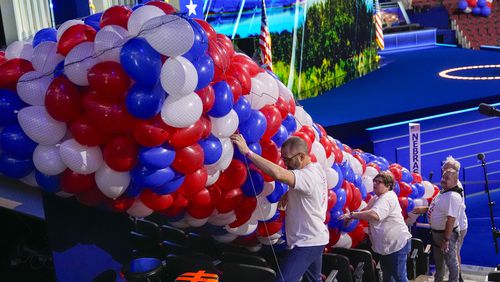 Workers move balloons Aug. 16 as they prepare the Democratic National Convention at the United Center in Chicago. (Pablo Martinez Monsivais/AP)