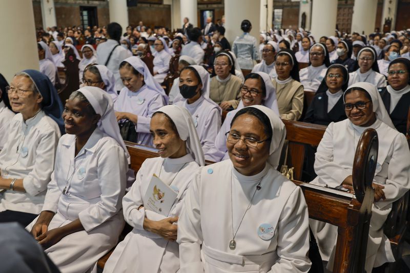 Nuns wait for the arrival of Pope Francis at the Cathedral of Our Lady of the Assumption in Jakarta Wednesday, Sept. 4, 2024. (Yasuyoshi Chiba/Pool Photo via AP)