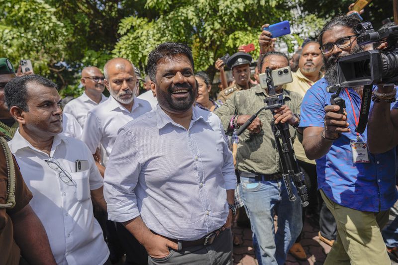 Leader and the presidential candidate of National People's Power Anura Kumara Dissanayake leaves a polling station after casting his vote in Colombo, Sri Lanka, Saturday, Sept. 21, 2024. (AP Photo/Eranga Jayawardena)