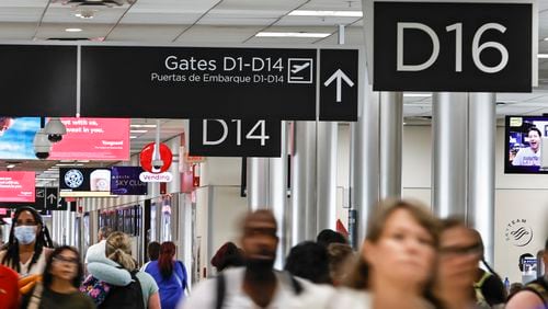 Passengers walk through Concourse D at Hartsfield-Jackson International Airport on Thursday, July 7, 2022.  (Natrice Miller/natrice.miller@ajc.com)