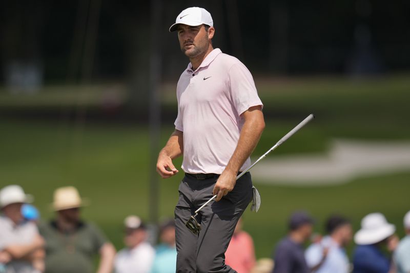 Scottie Scheffler walks on the fifth green during the second round of the Tour Championship golf tournament, Friday, Aug. 30, 2024, in Atlanta. (AP Photo/Mike Stewart)