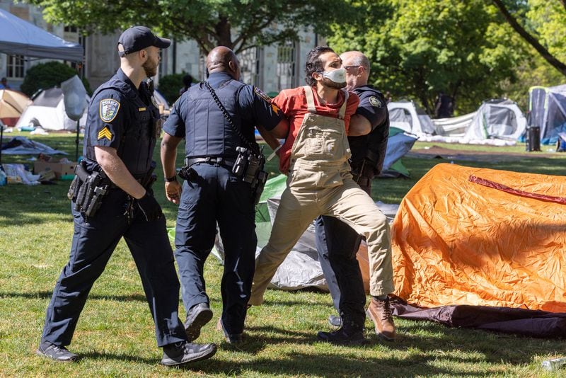 Police arrest pro-Palestinian protestors who set up an encampment at  Emory University in Atlanta on  April 25, 2024. (Arvin Temkar/Atlanta Journal Constitution)