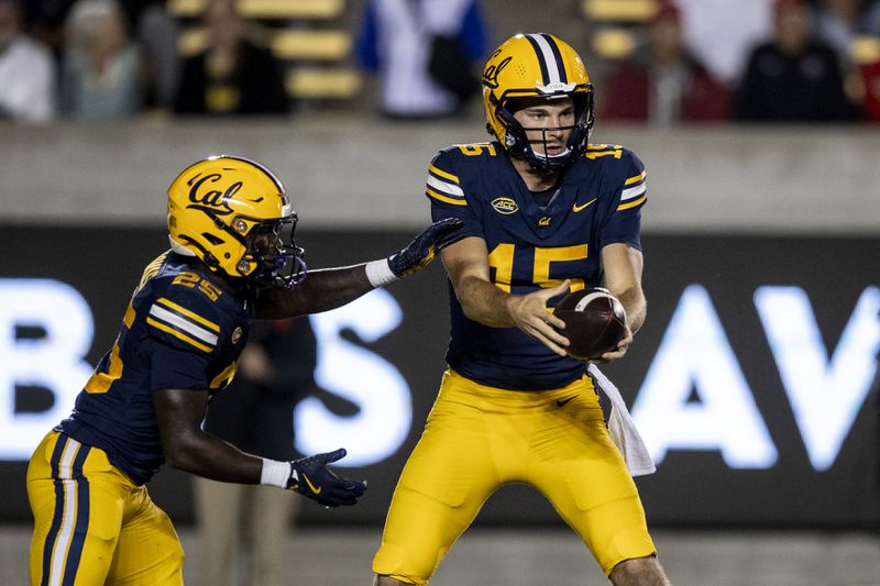 California quarterback Fernando Mendoza (15) passes the ball to running back Jaivian Thomas (25) during the first half of their NCAA football game against San Diego State in Berkeley, Calif., Saturday, Sept. 14, 2024.(Stephen Lam/San Francisco Chronicle via AP)/San Francisco Chronicle via AP)