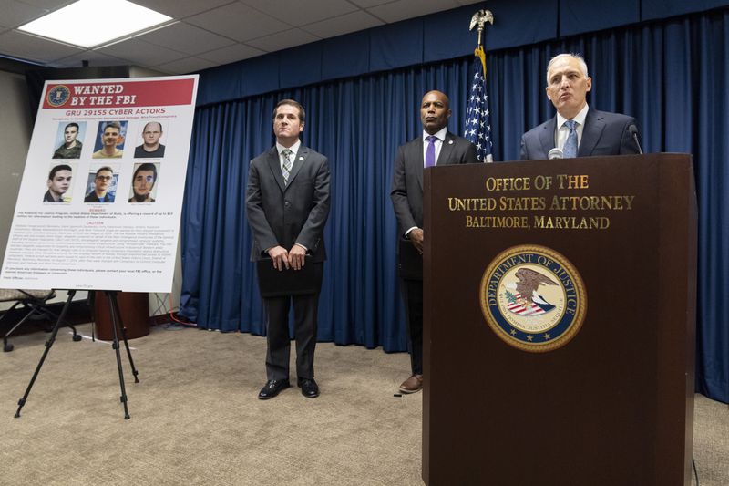 From right, Assistant Attorney General for National Security Matthew G. Olsen, speaks next to Erek L. Barron, US Attorney for the District of Maryland and William J. DelBagno, special agent in charge of the FBI Baltimore Field Office, during a news conference at the Office of the United States Attorney in Baltimore, Thursday, Sept. 5, 2024. (AP Photo/Stephanie Scarbrough)