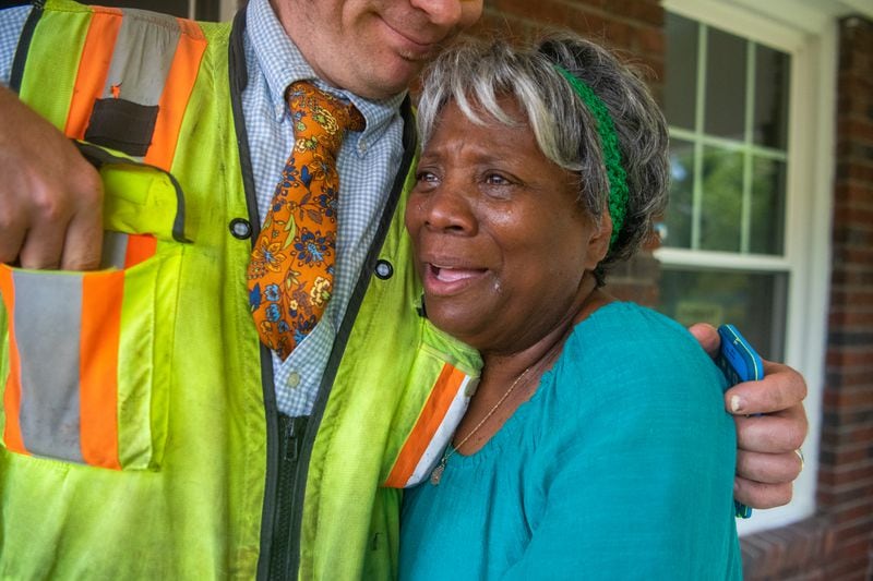 Dorothy Williams gets emotional over progress on her home.