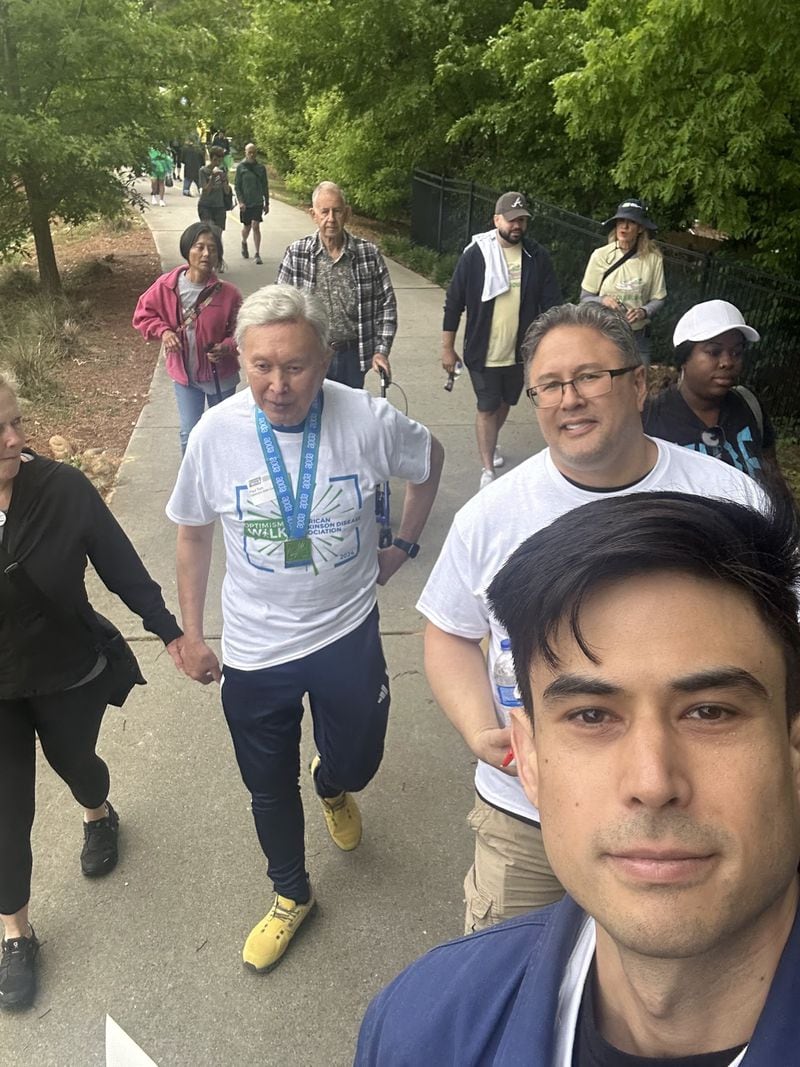 Paul Tom, center, with walking team at the APDA Georgia Optimism Walk 2024. From left, Lorie Coats, Paul Tom, James Tom, and Colin Tom. (Photo by Colin Tom)