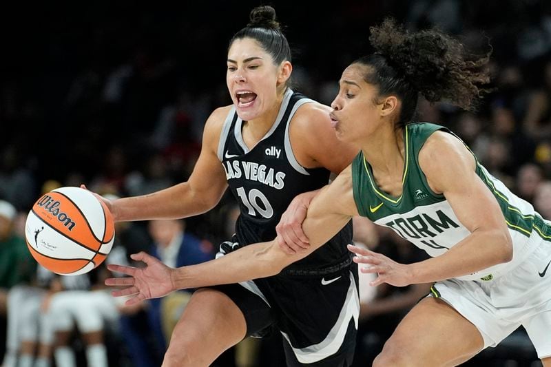 Las Vegas Aces guard Kelsey Plum (10) drives against Seattle Storm guard Skylar Diggins-Smith (4) during the second half in Game 2 of a WNBA basketball first-round playoff game Tuesday, Sept. 24, 2024, in Las Vegas. (AP Photo/John Locher)