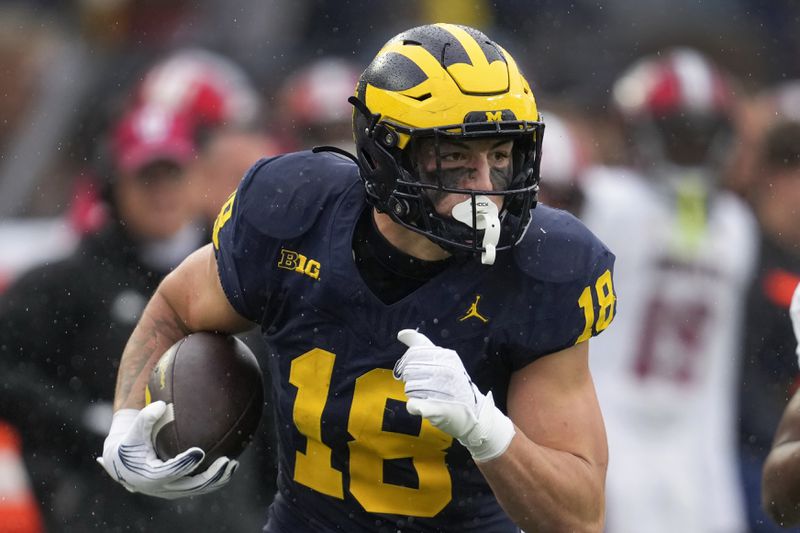 FILE - Michigan tight end Colston Loveland catches a pass against Indiana in the second half of an NCAA college football game in Ann Arbor, Mich., Saturday, Oct. 14, 2023. (AP Photo/Paul Sancya, File)