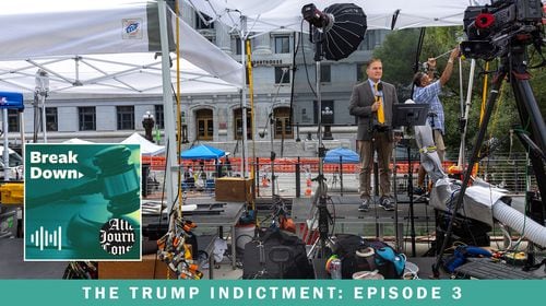 A Fox News reporter stands outside the Fulton County Courthouse the day after a grand jury made its indictment against former President Donald Trump. The AJC's 'Breakdown' podcast examines the aftermath of the indictment and efforts to move the case. (Arvin Temkar / arvin.temkar@ajc.com)