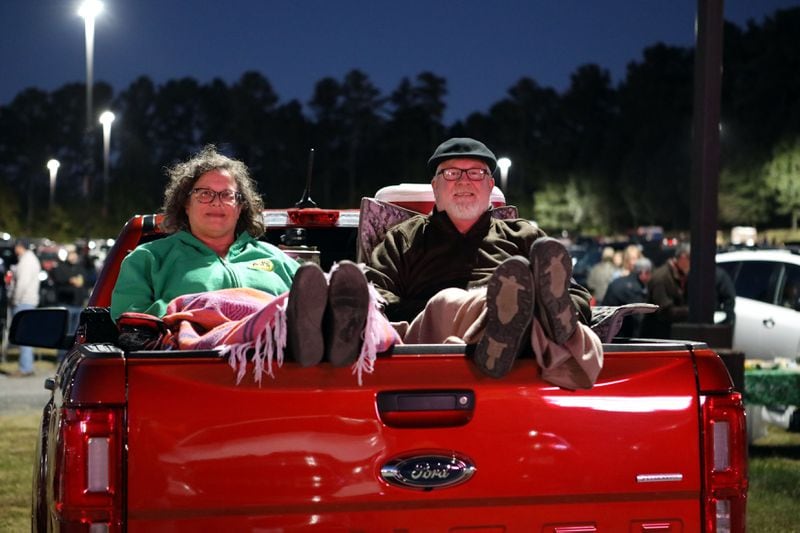 Elaine and Chris Clark, from Pine Lake, Georgia, watch the Jason Isbell concert from the back of their truck.
