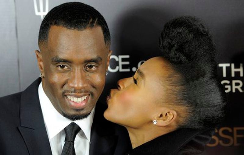 Diddy signed Monae to his Bad Boy Records in 2008. She thanked him with a kiss for giving "a girl from Kansas" a shot.