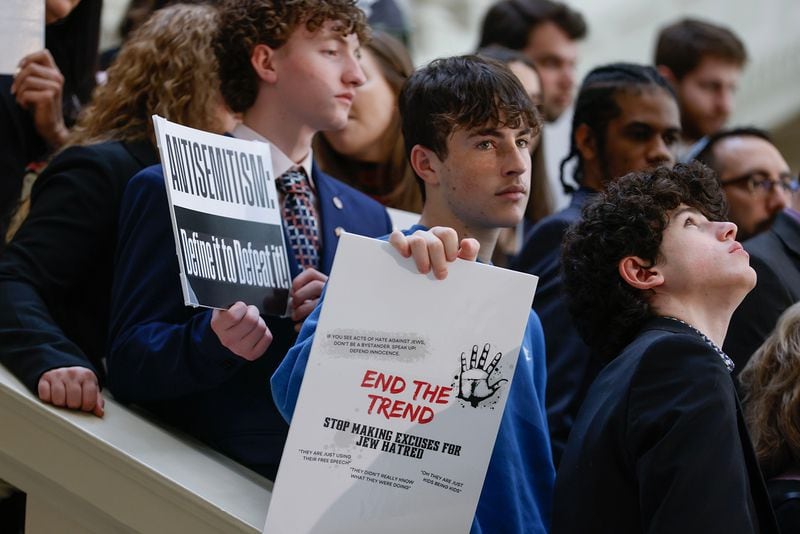 Members of the Jewish community and supporters hold signs during a press conference in February at the Georgia Capitol focusing on antisemitism. (Natrice Miller/Atlanta Journal-Constitution/TNS)